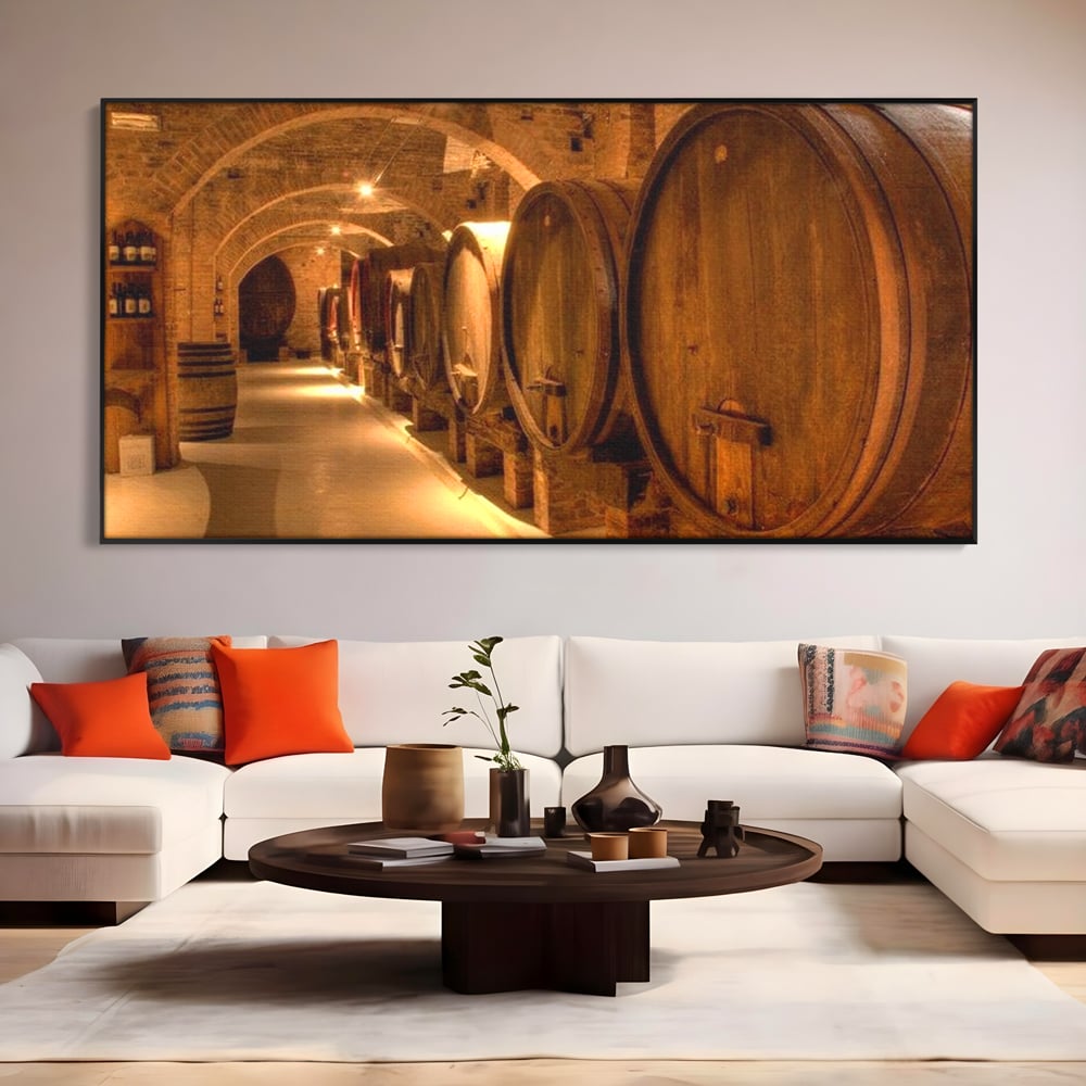 Tablou canvas cu tablou canvas cu butoaie de vin in crama, in rama de aluminiu negru, pe perete intr-un living